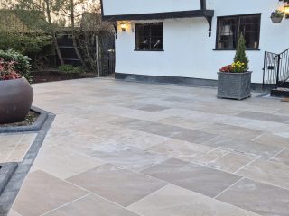 Elegant Beige Stone Courtyard with Planters